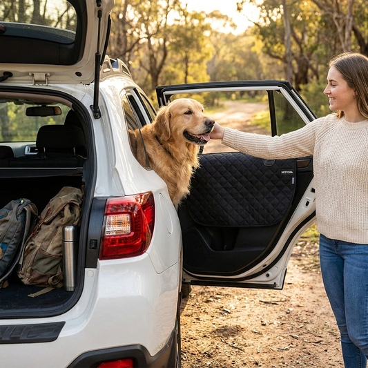 Woman petting Golden Retriever in SUV with Nestora SafeRide cover, outdoor adventure